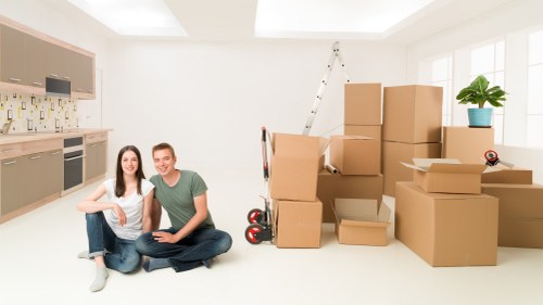 Stacked labeled boxes and furniture in storage space