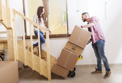 Professional team handling office furniture during an Aperfield move